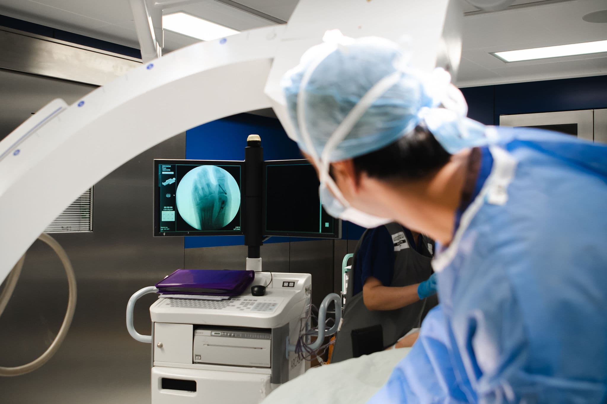 Image of Mr Kaser Nazir with C-arm X-ray machine